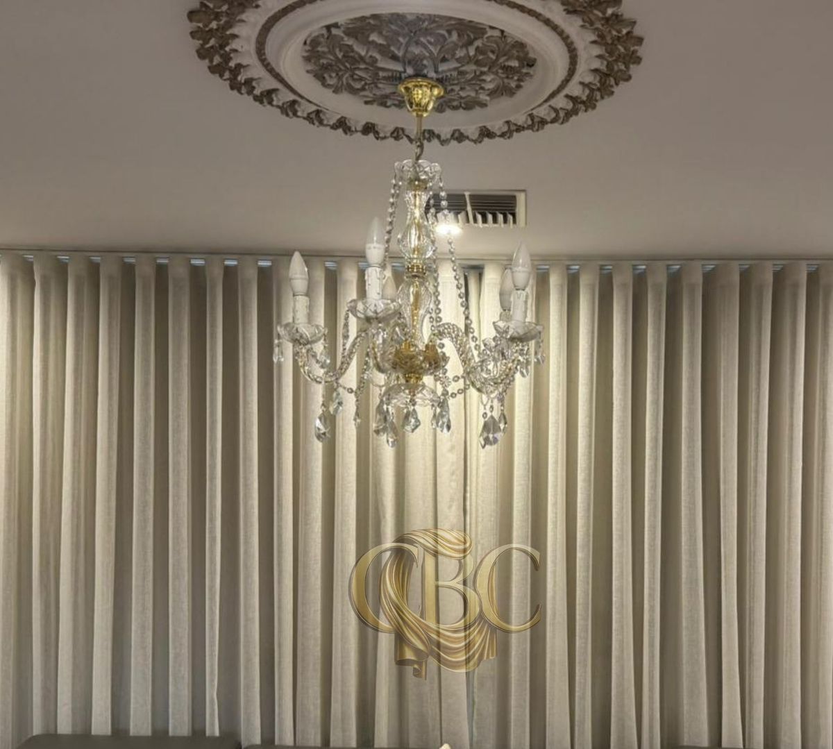 Full-width S-Wave drapes in a formal lounge