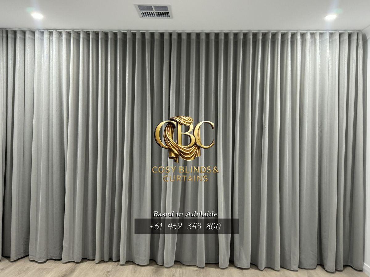 Grey S-Wave curtains, hung to break at the floor